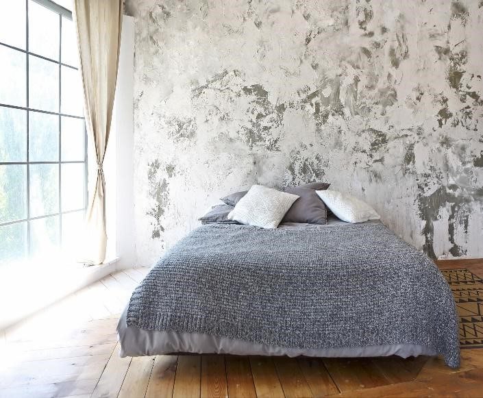 grey contrast plaster wall in bedroom