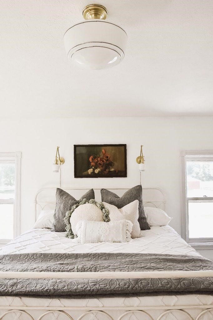wall light in white color in white themed bedroom