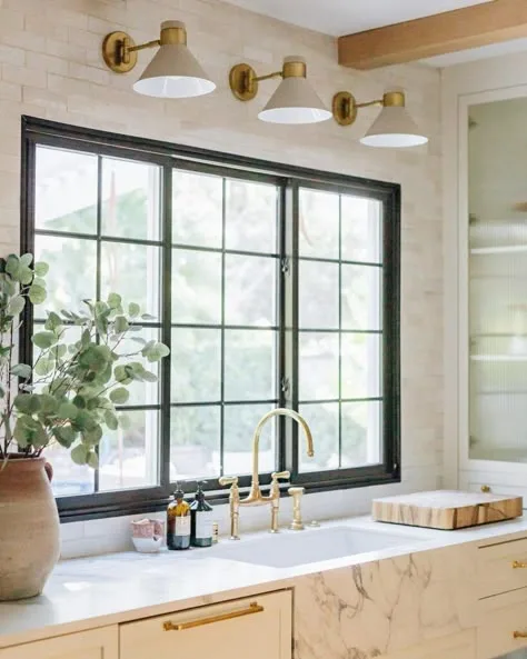 window lighting in kitchen with sconces