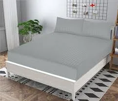 grey king size bedsheet with grey patterned rug