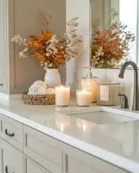 easy upkeep the counter by candles and fall flowers