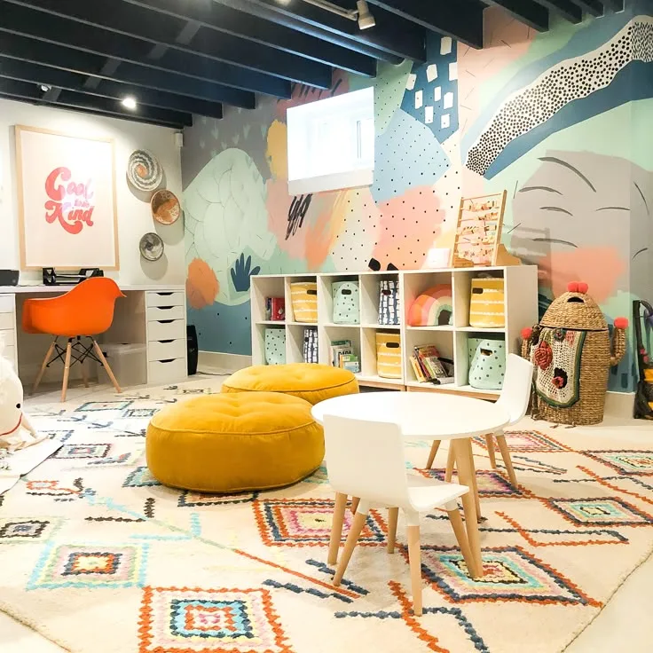 floor rug with cushions and white table and chairs. Additional cabinets with storage items